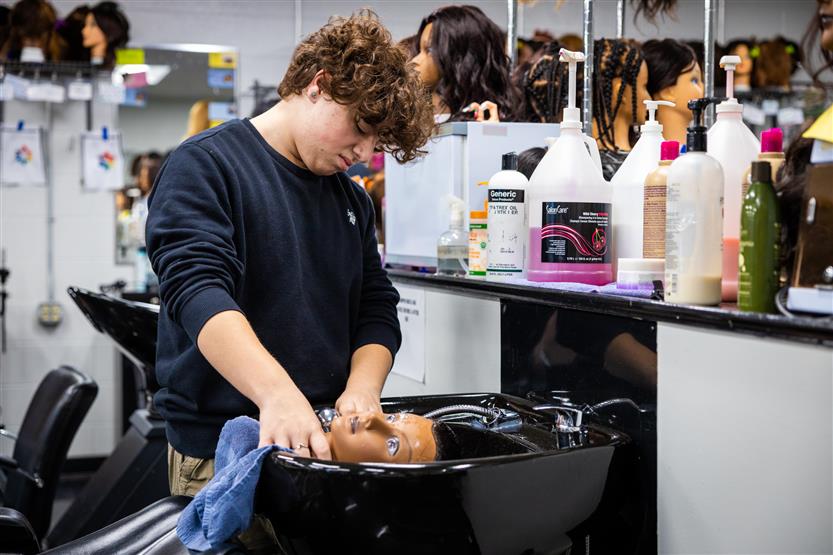 Centennial High students in the cosmetology class